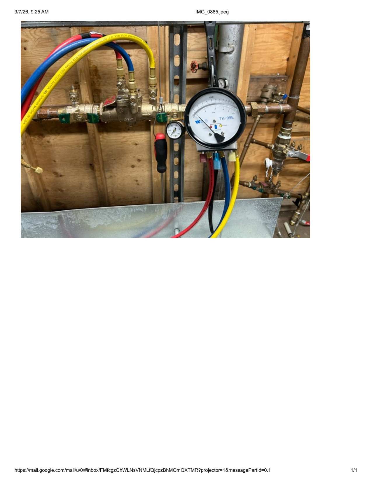 Backflow prevention assembly being tested with gauges